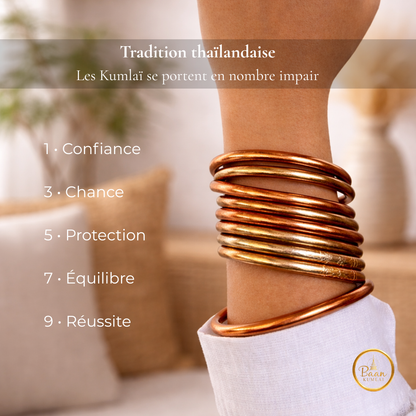 Bracelets Kumlaï cuivre portés au poignet – joncs bouddhistes traditionnels thaïlandais